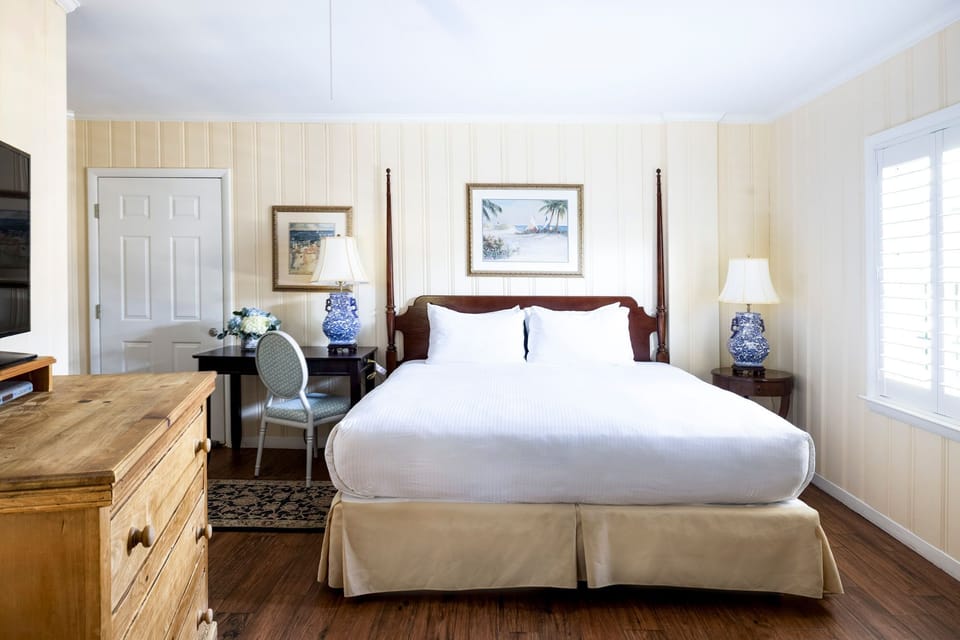 A charming bedroom retreat with classic furnishings and warm, inviting tones.