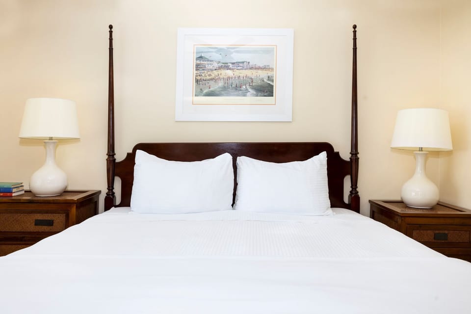 A timeless bedroom with elegant four-poster bed and soft lighting for a restful retreat.