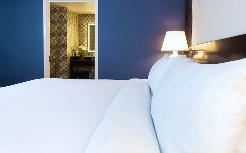 Serene and sophisticated, with crisp linens and soft lighting for the ultimate restful escape.