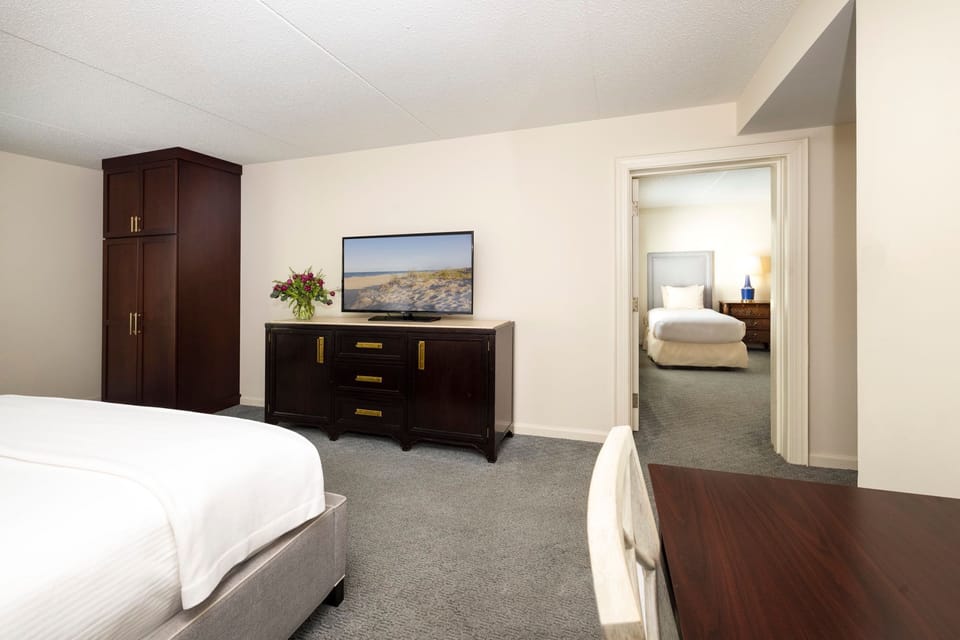 A spacious and well-appointed guest room offering comfort and relaxation.