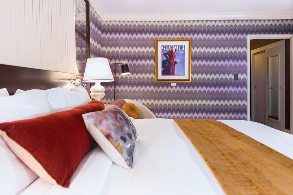 Luxurious comfort with artistic flair, where rich colors and striking décor create a one-of-a-kind experience.
