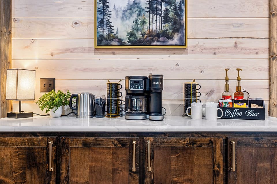 Coffee Bar stocked with Keurig pods, drip coffee, sugar, and creamer — caffeine lovers rejoice!