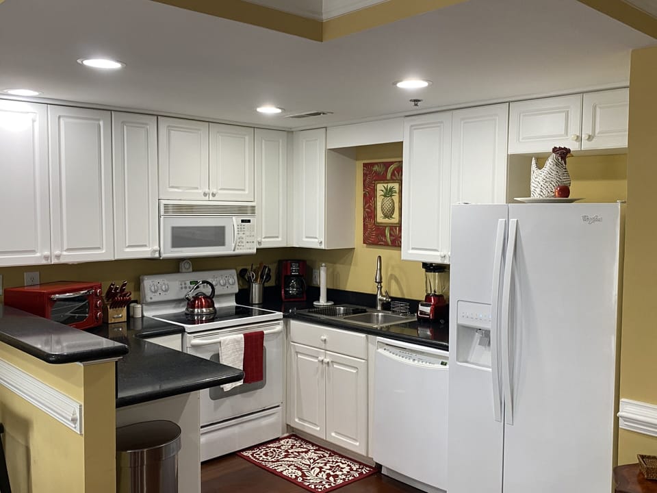 Signature Condo, 2 Bedrooms, Kitchen, River View (Condo 7) | Private kitchen | Fridge, microwave, stovetop, coffee/tea maker