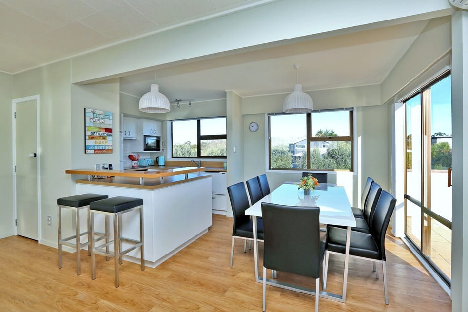Kitchen, dining and barstool seating.