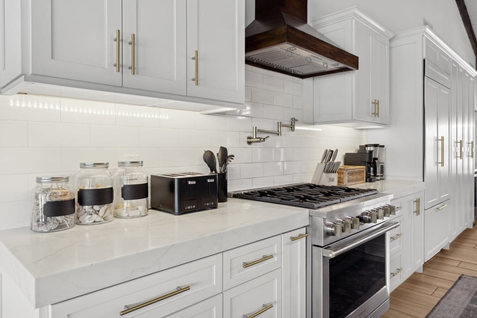 Fully stocked chef’s kitchen with gas range and pot filler