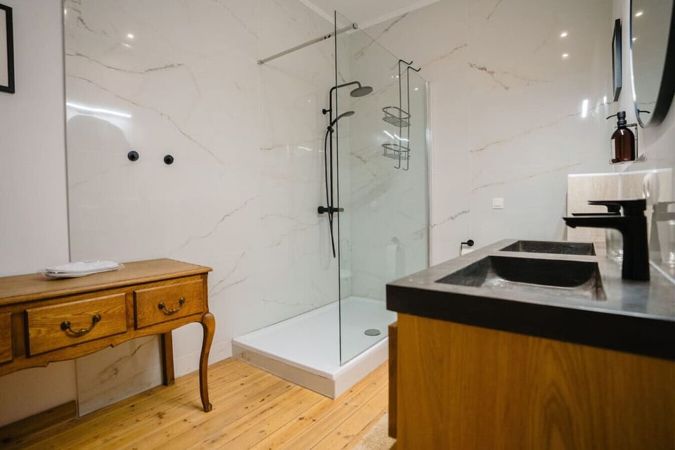 Modern bathroom with rain shower and toilet