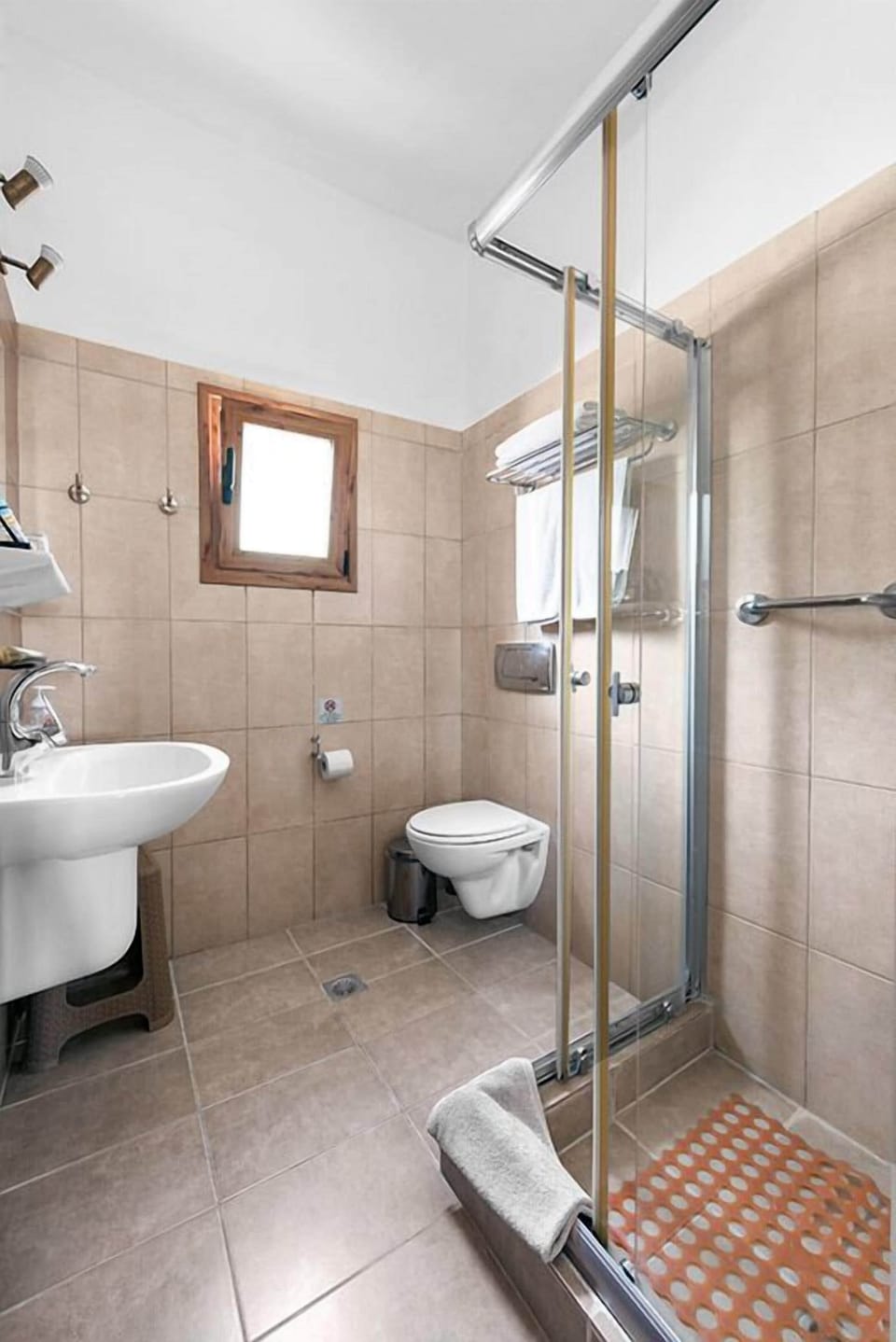 Shower, hair dryer, towels, toilet paper