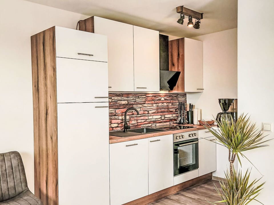 Wood, Interior Design, Flooring, Cabinetry, Kitchen, Floor, Apartment, Furniture, Home, Kitchen Appliance