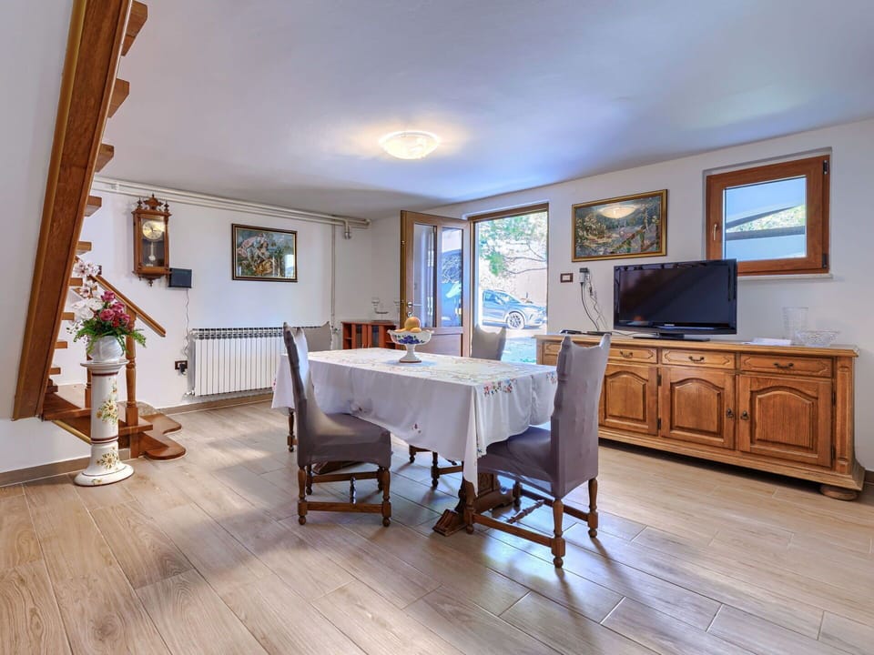 Furniture, Wood, Interior Design, Flooring, Kitchen, Cabinetry, Floor, Room, Major Appliance, Cupboard