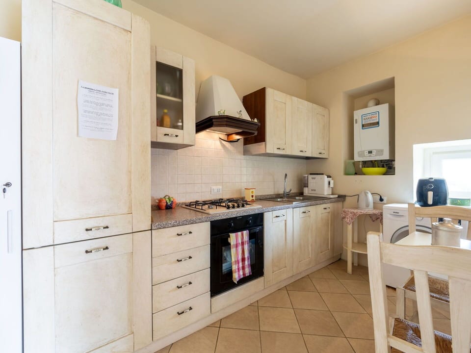 Furniture, Wood, Interior Design, Flooring, Kitchen, Cabinetry, Floor, Room, Major Appliance, Cupboard
