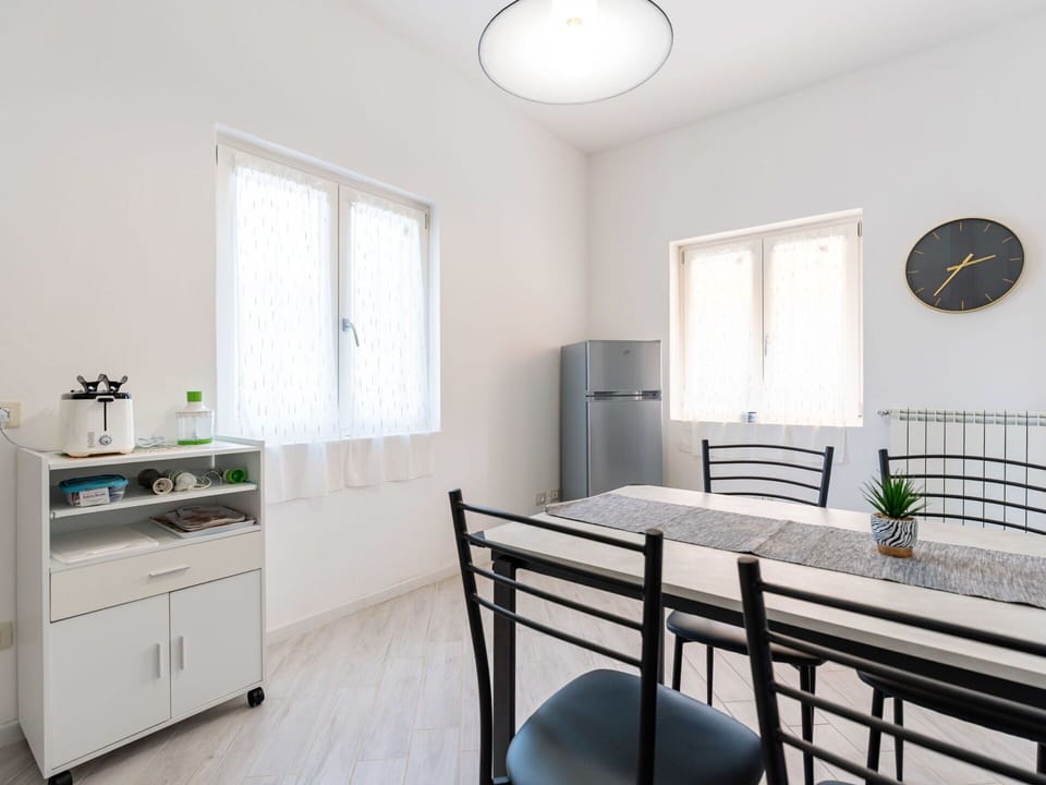 Furniture, Wood, Interior Design, Flooring, Kitchen, Cabinetry, Floor, Room, Major Appliance, Cupboard