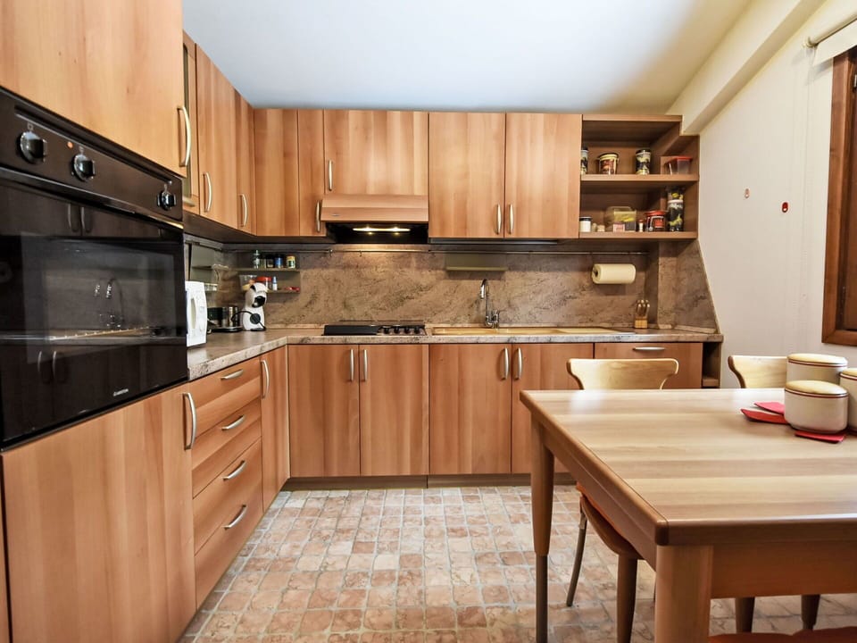 Furniture, Wood, Interior Design, Flooring, Kitchen, Cabinetry, Floor, Room, Major Appliance, Cupboard