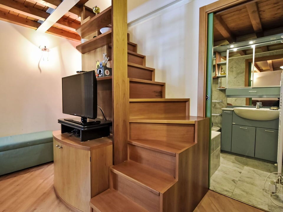 Furniture, Wood, Interior Design, Flooring, Kitchen, Cabinetry, Floor, Room, Major Appliance, Cupboard