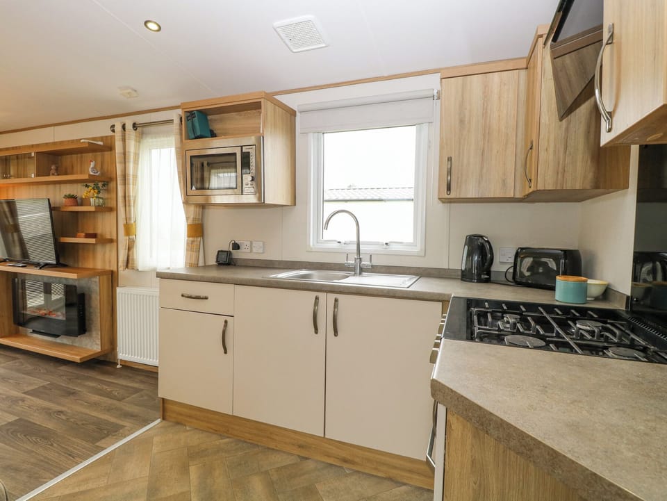 Fridge, microwave, toaster, cookware/dishes/utensils