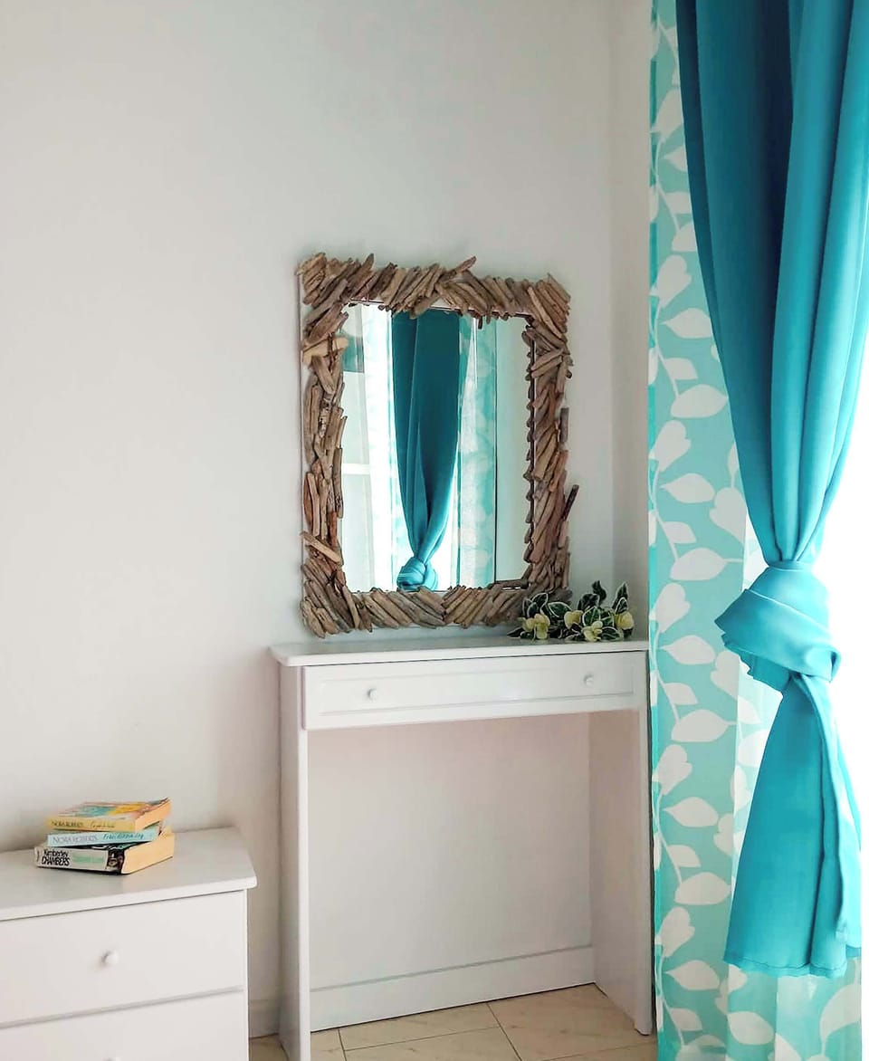 Room Details – Mirror and Storage Niche
Small decorative corner offering charm and convenience.