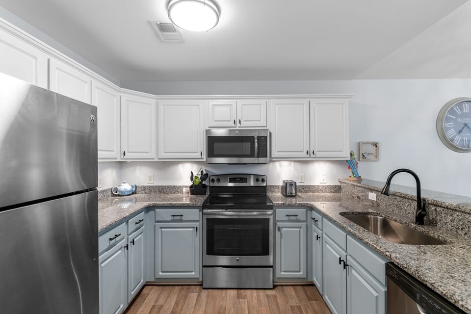 Your fully equipped kitchen awaits with granite counters, stainless appliances, and everything you need to create memorable meals during your stay.