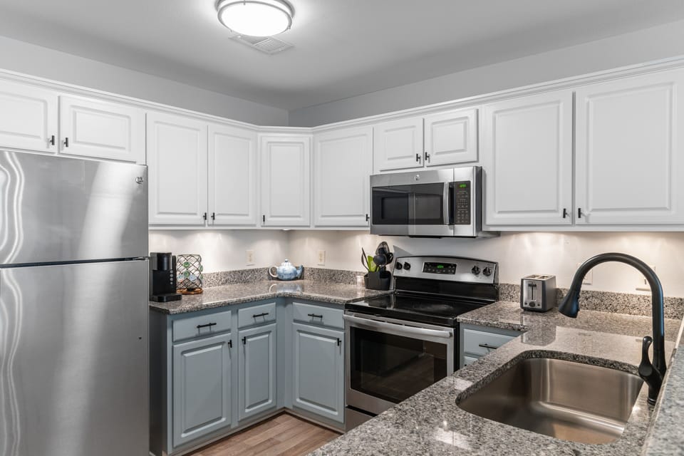 Your fully equipped kitchen features granite countertops, stainless steel appliances, and ample cabinet space for all your culinary adventures.