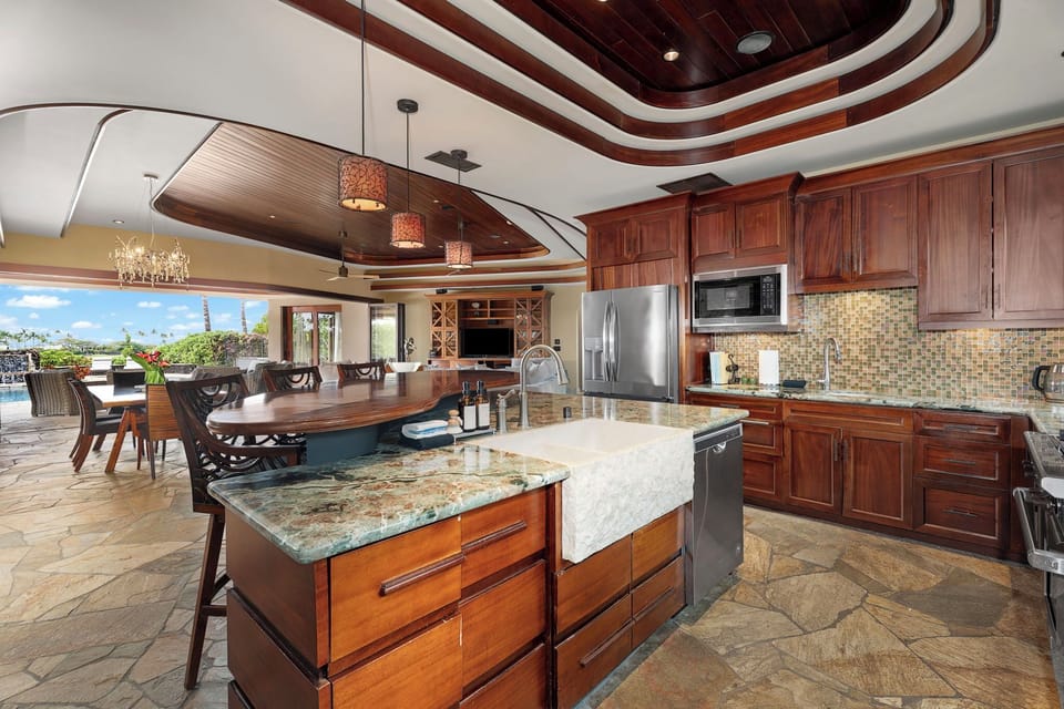 A chef’s dream kitchen featuring rich wood finishes and high-end countertops.