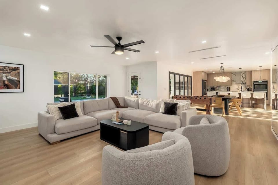 Relax in this bright, open living space where plush seating invites you to unwind. Natural light and a modern ceiling fan keep you comfortable year-round.