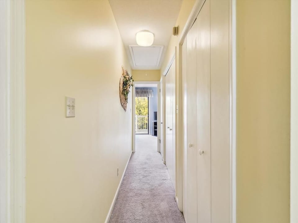 Bright and welcoming, the hallway leads you to a family-friendly layout designed for comfort and convenience.