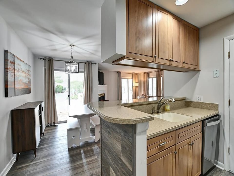 A well-equipped kitchen with a breakfast bar, perfect for preparing meals and socializing.