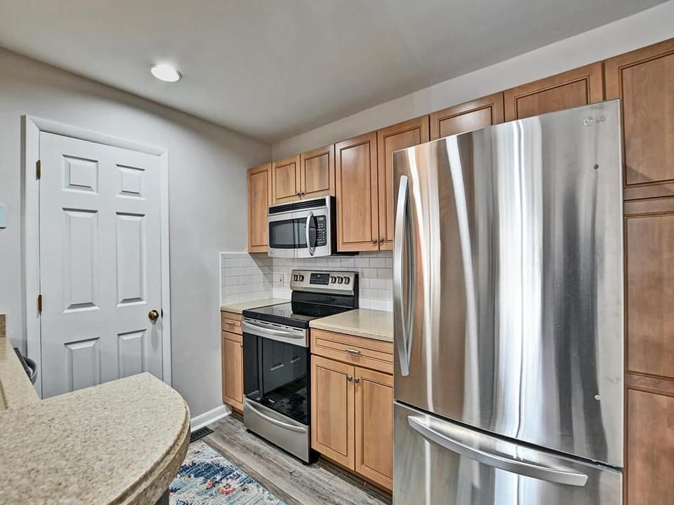 Stainless steel appliances and ample counter space make this kitchen a home chef’s dream.