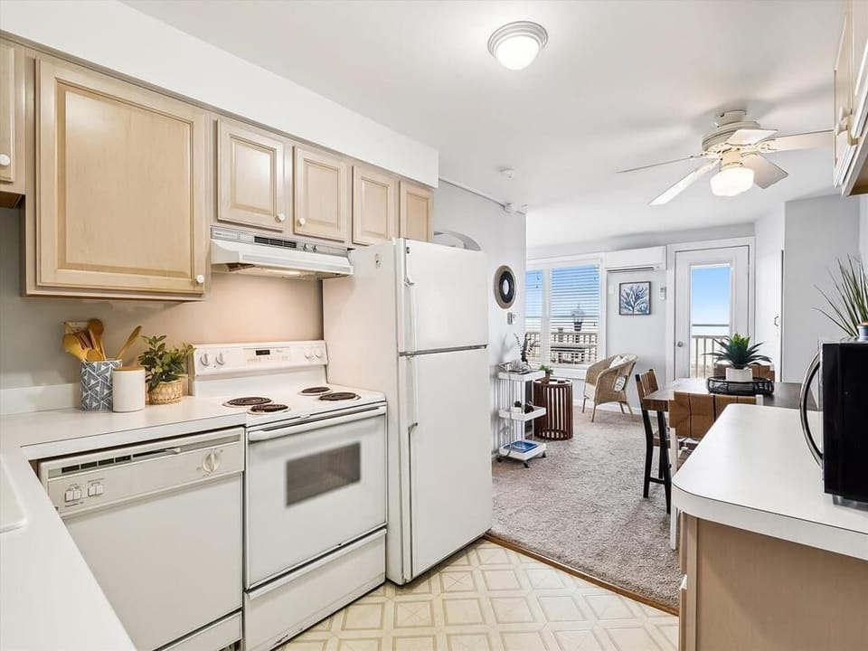 Open-concept kitchen and dining area, perfect for enjoying meals with ocean breezes just steps away.