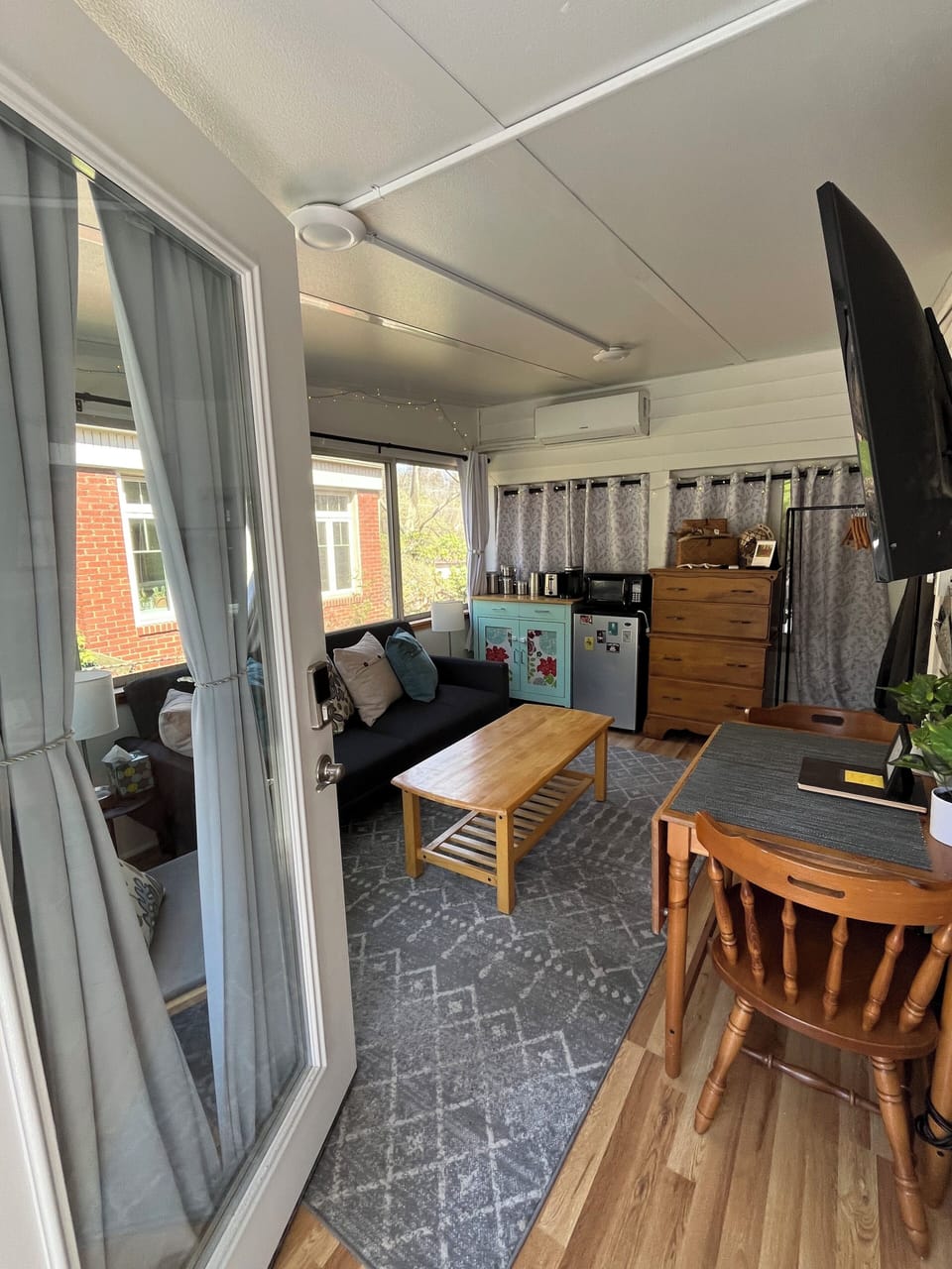 View of sitting area and kitchenette from entrance