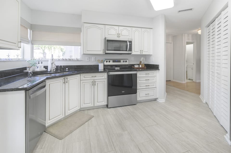 Fully equipped with modern appliances, the kitchen makes meal prep a breeze—whether you're brewing morning coffee or cooking up local seafood