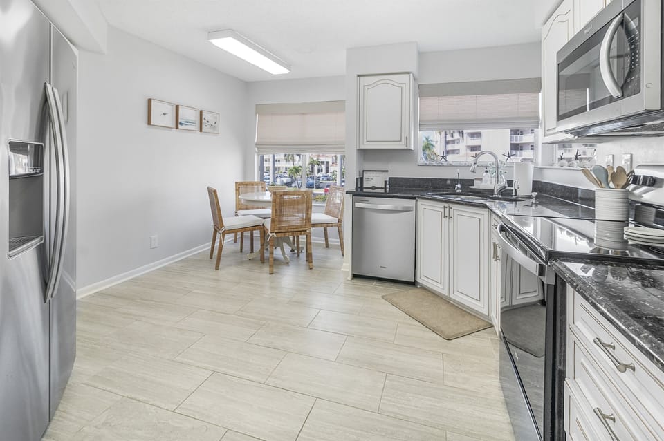 Fully equipped with modern appliances, the kitchen makes meal prep a breeze—whether you're brewing morning coffee or cooking up local seafoodhen Area