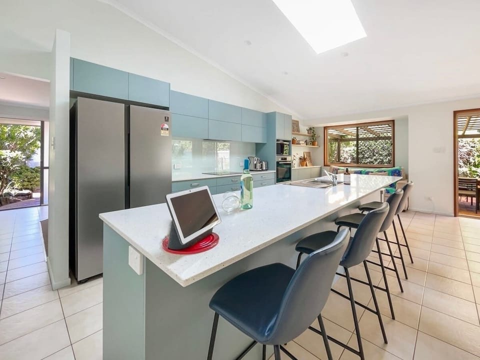 The well-sized kitchen is fully-equipped with stainless steel appliances and all the essentials.