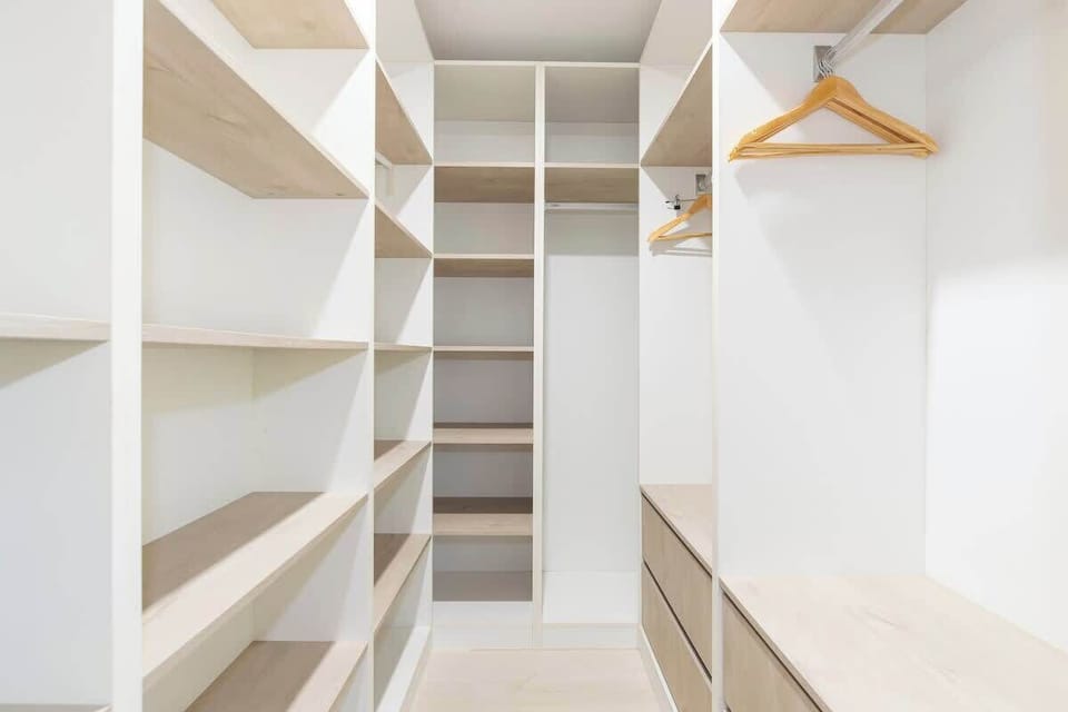 A spacious walk-in robe in the primary bedroom provides ample storage space.