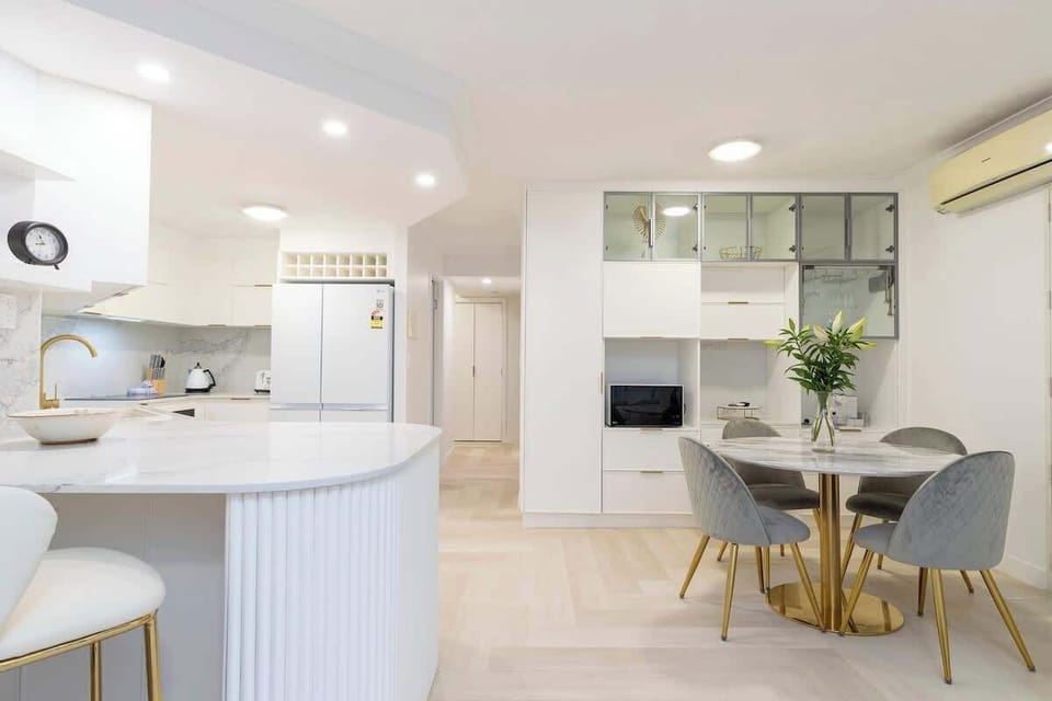 An open plan kitchen and dining area is thoughtfully appointed.