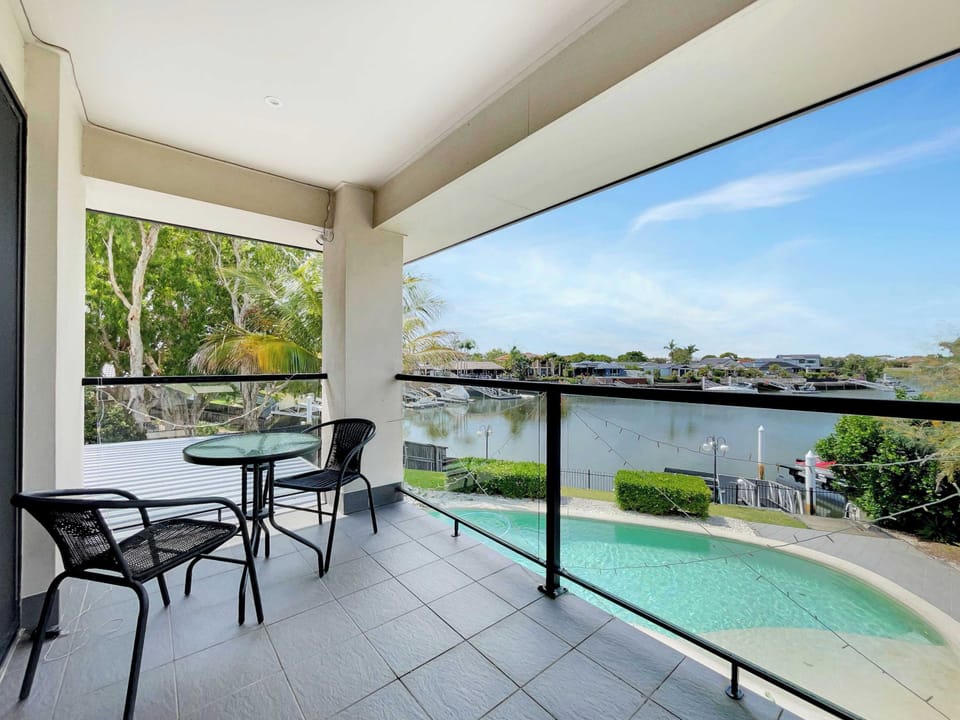 Step out from the main bedroom to your private balcony, perfect for a quiet morning coffee with peaceful water views.