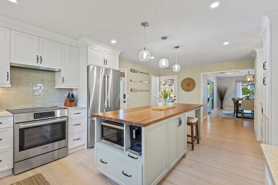 It is a culinary haven, while the large sunroom and outdoor deck provide the perfect spaces to soak up island life.