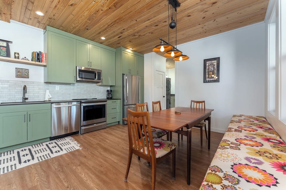 Open-concept kitchen with dishwasher and drip-style coffee maker