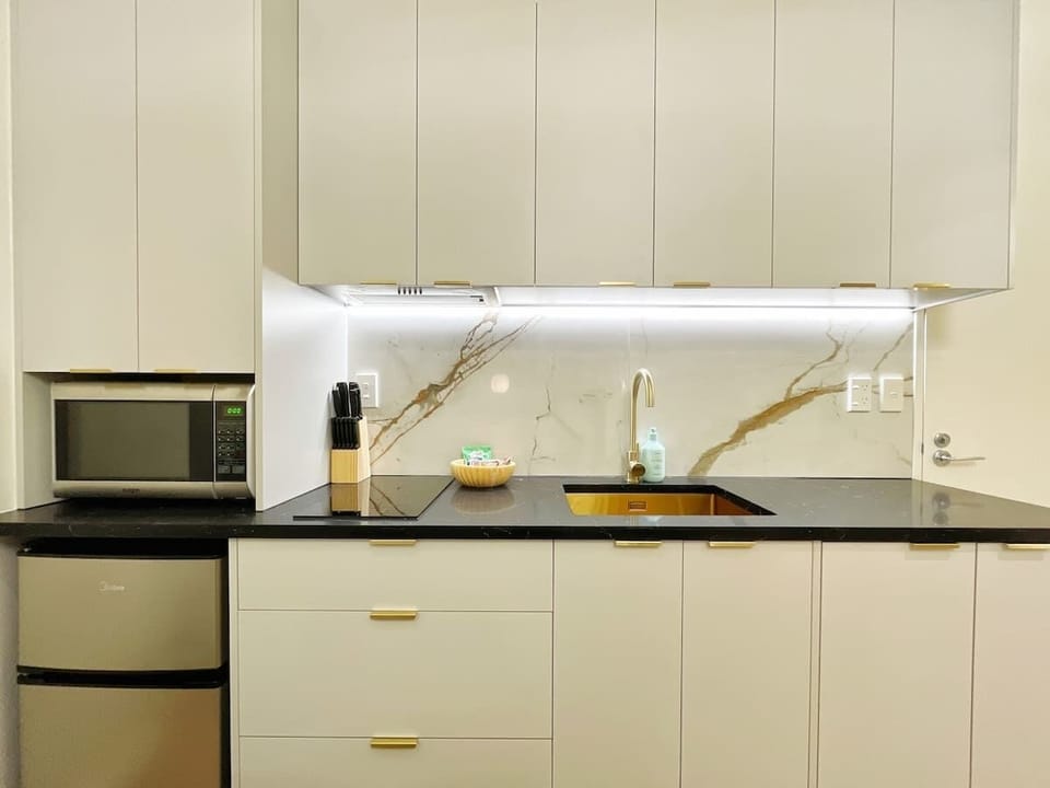The kitchen comes with a refrigerator, stove and oven/microwave. Additionally, the kitchen is stocked with all the essential utensils making it easy to prepare your own meals during your stay. 

A Washer/Dryer is conveniently located in the kitchen.