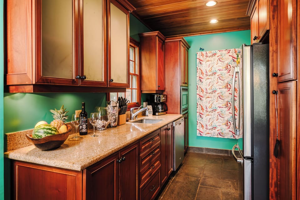 Fully equipped gourmet kitchen with modern appliances, custom cabinetry, and coastal design at a luxury Tamarindo vacation rental in Costa Rica. Open layout ideal for family meals, entertaining, extended stays, and beach living in Langosta Beach.
