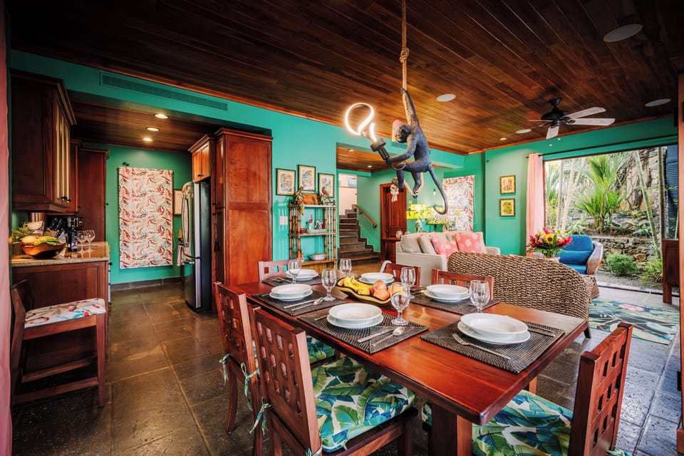 > Elegant dining table and stylish coastal decor at a luxury Playa Langosta vacation rental in Tamarindo, Costa Rica. Warm open space designed for family meals, entertaining, group stays, and comfortable beach house living near surf and beaches.
