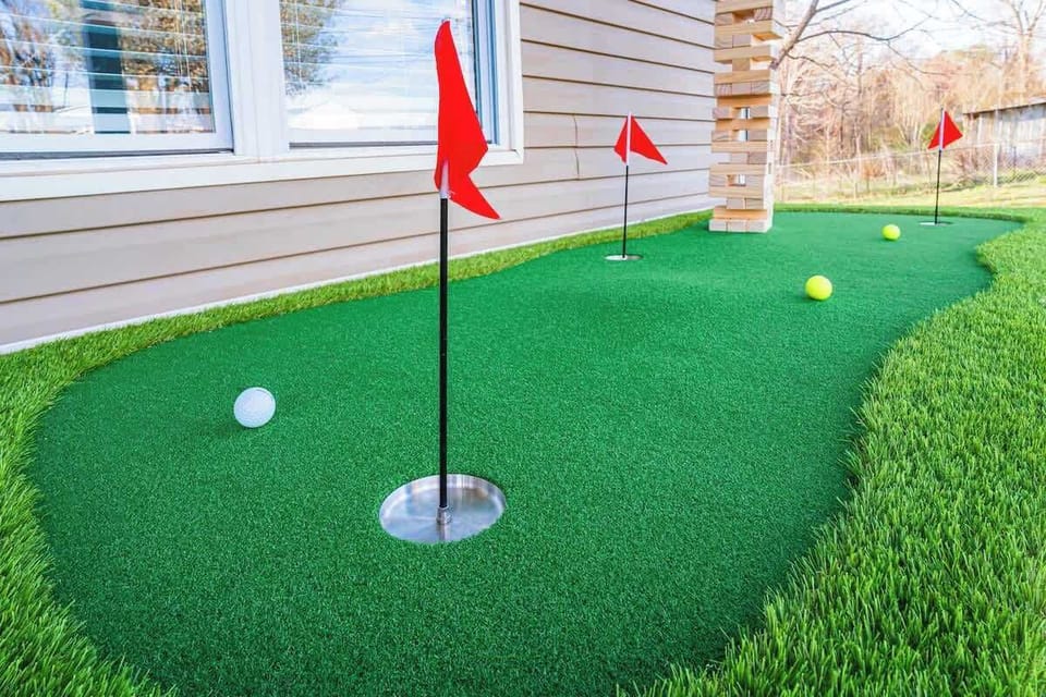 Endless fun with our mini golf putting green & giant Jenga topping tower...