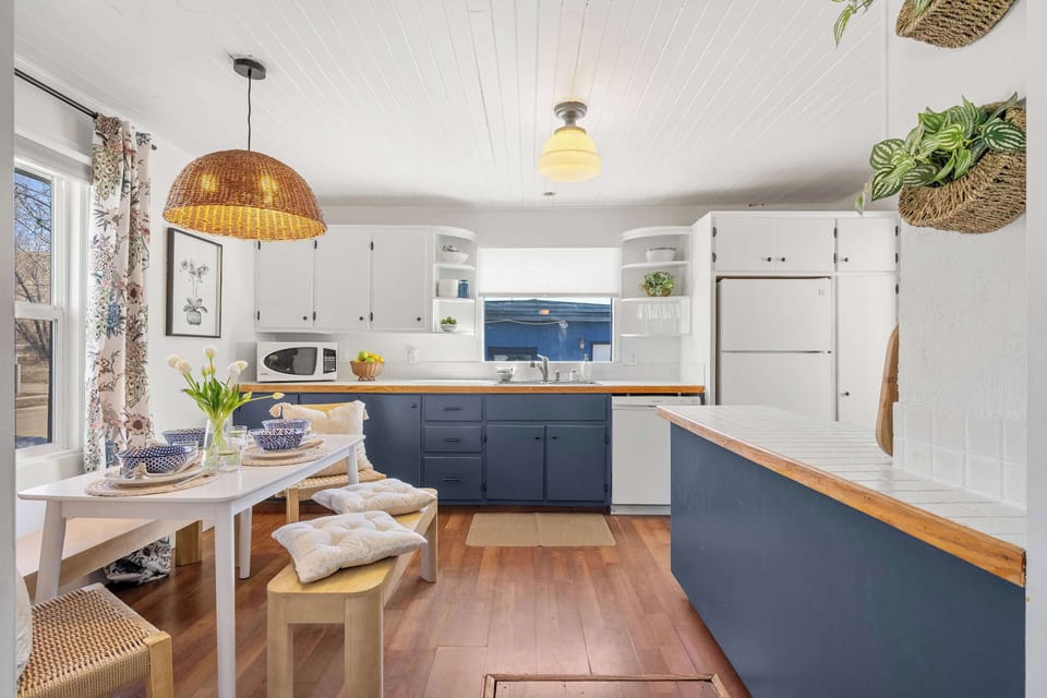 Well appointed kitchen with fridge, stove, seating and all the kitchen essentials.