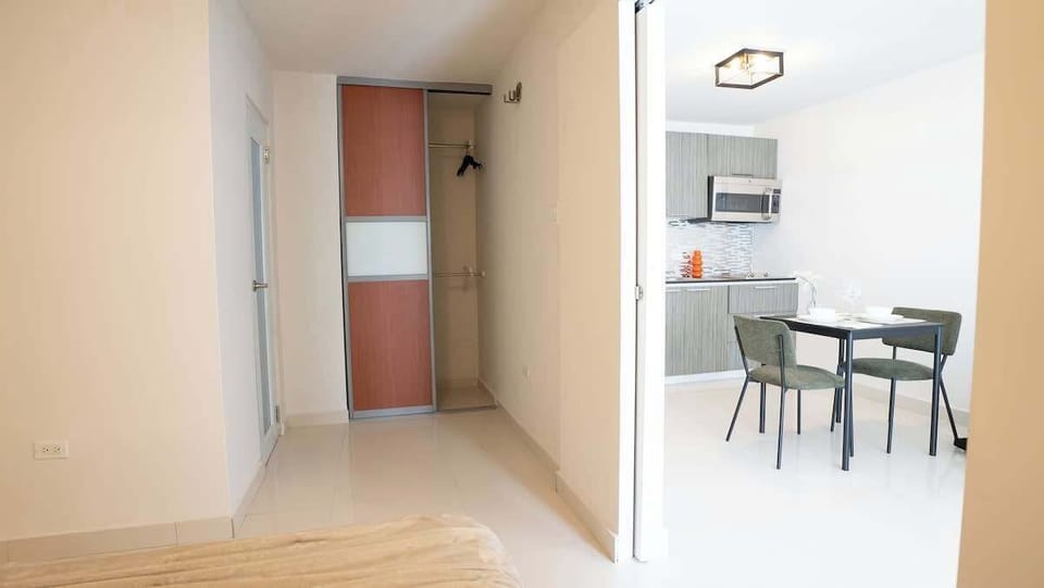 The bedroom connects easily to the main living area for added convenience.