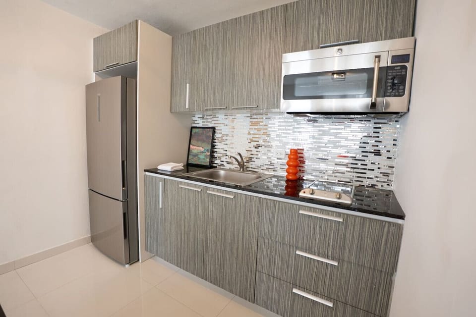 Modern kitchen with high-end appliances and stylish finishes.