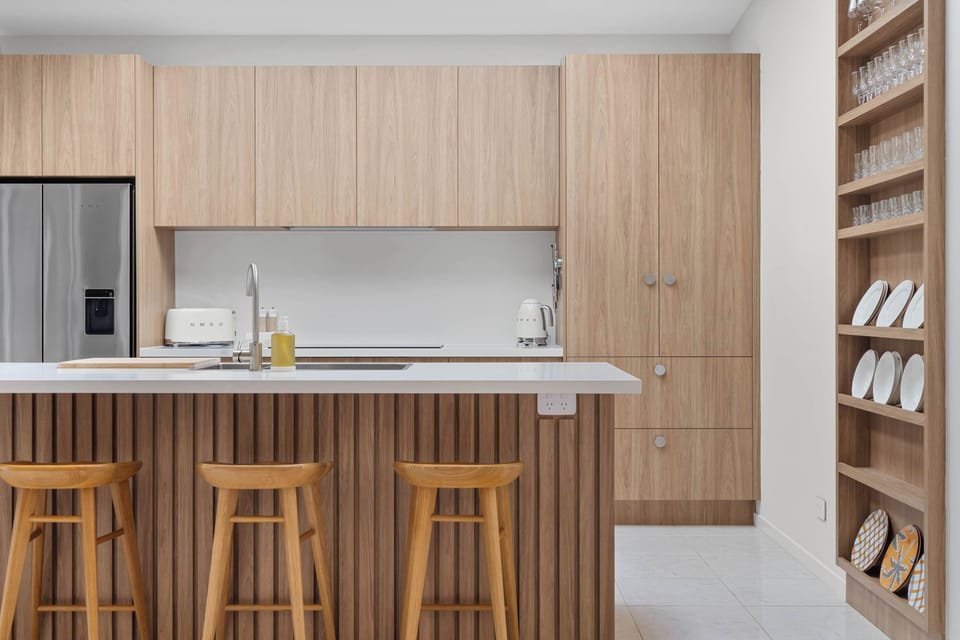 Modern, family-friendly kitchen with ample bench space.