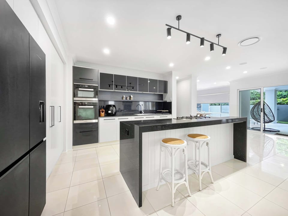 High end kitchen finishes with stone benchtops.