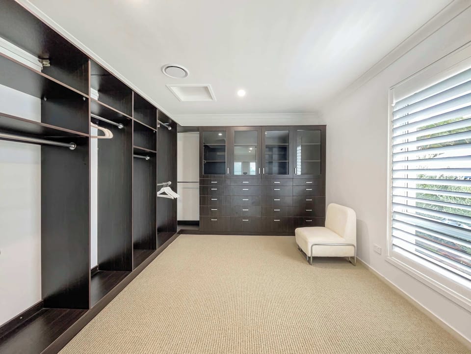 Walk in wardrobe providing generous storage.