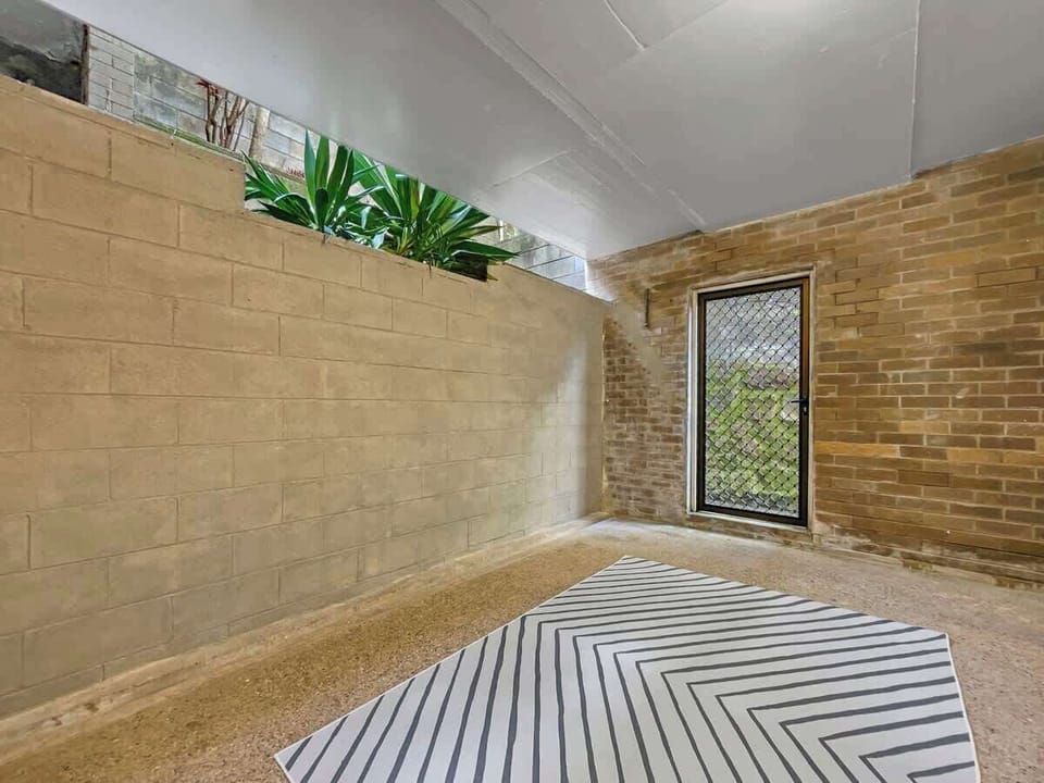 Enjoy access to an enclosed, private courtyard, providing additional unfurnished outdoor space.