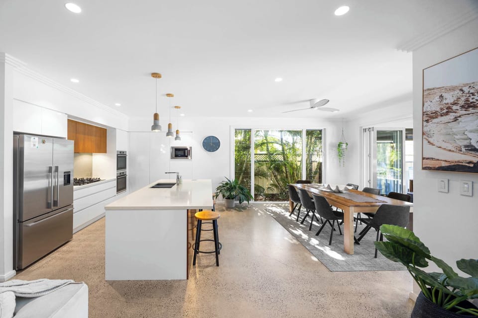 A modern, open-plan design creates an airy indoor-outdoor flow.