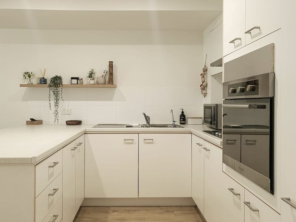 The kitchen is fully equipped and functional, with everything you need to cook at home.