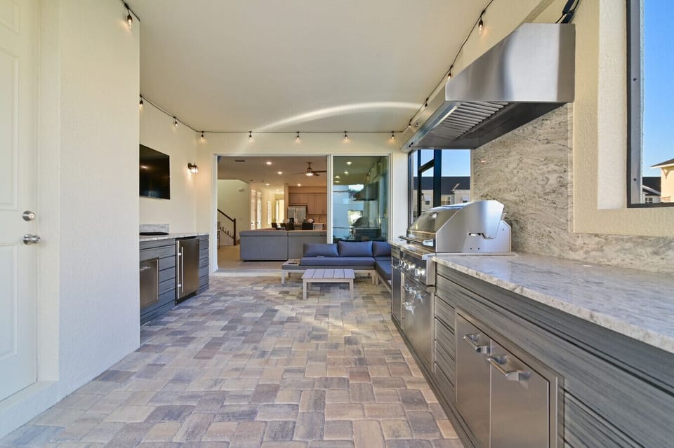Covered outdoor kitchen for poolside grilling
